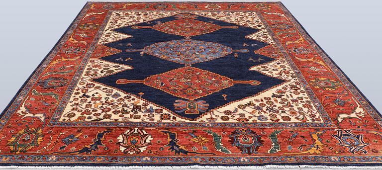 A Zigler, Heris Design carpet, 298 x 247 cm.