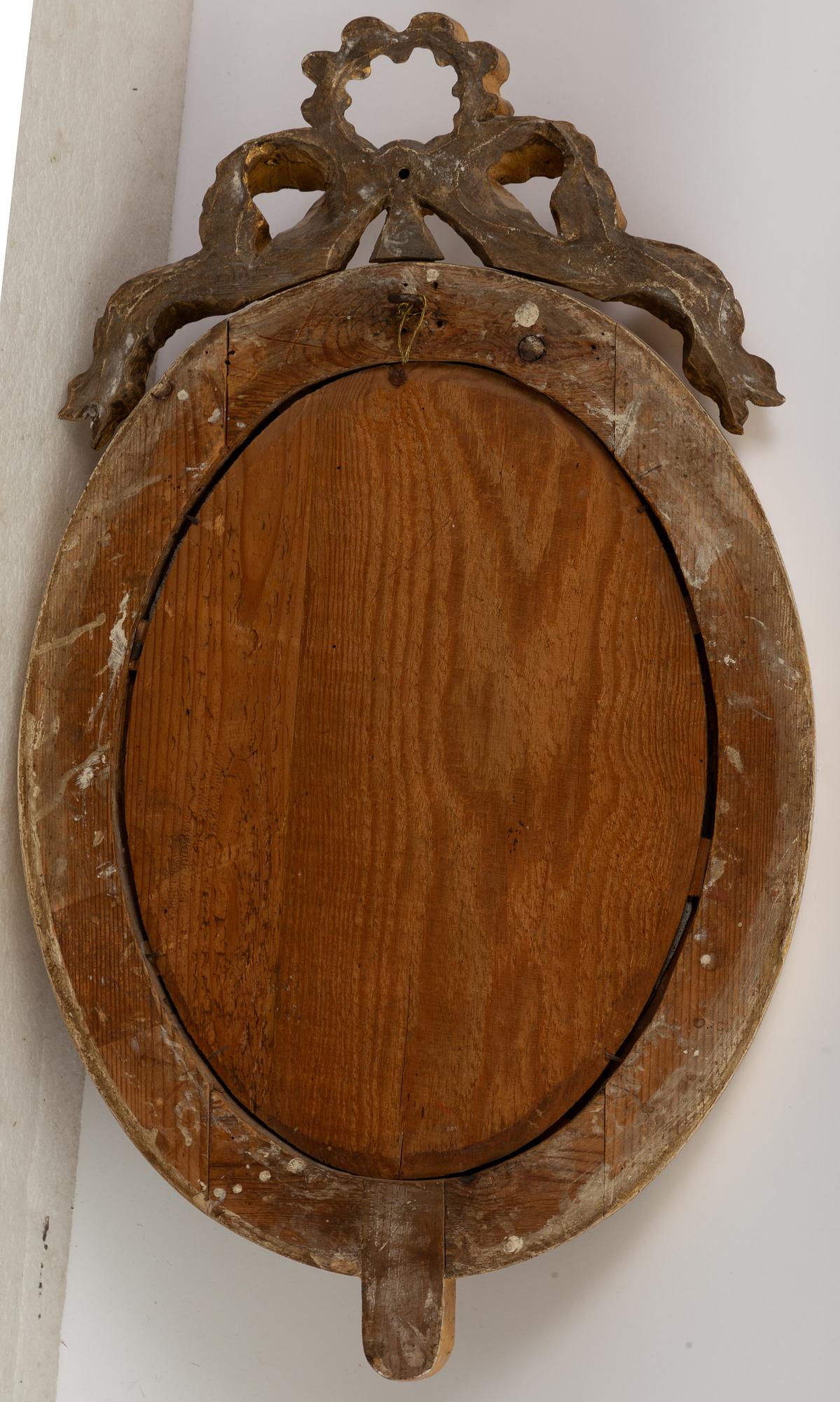 A pair of late Gustavian one-branch giltwood girandole mirrors, Stockholm, circa 1800.
