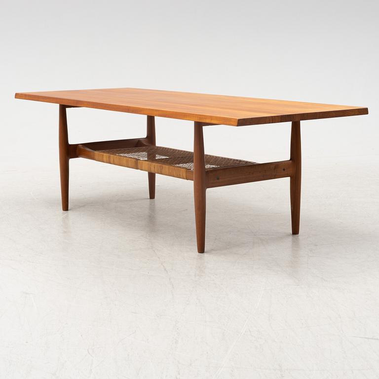 A composite teak coffee table with a rattan shelf, Denmark, 1950/60s.