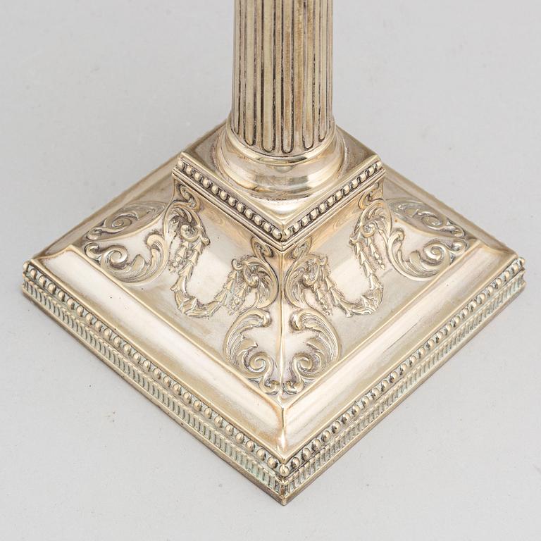 A pair of English silver plate candlesticks, probably first half of the 20th century.