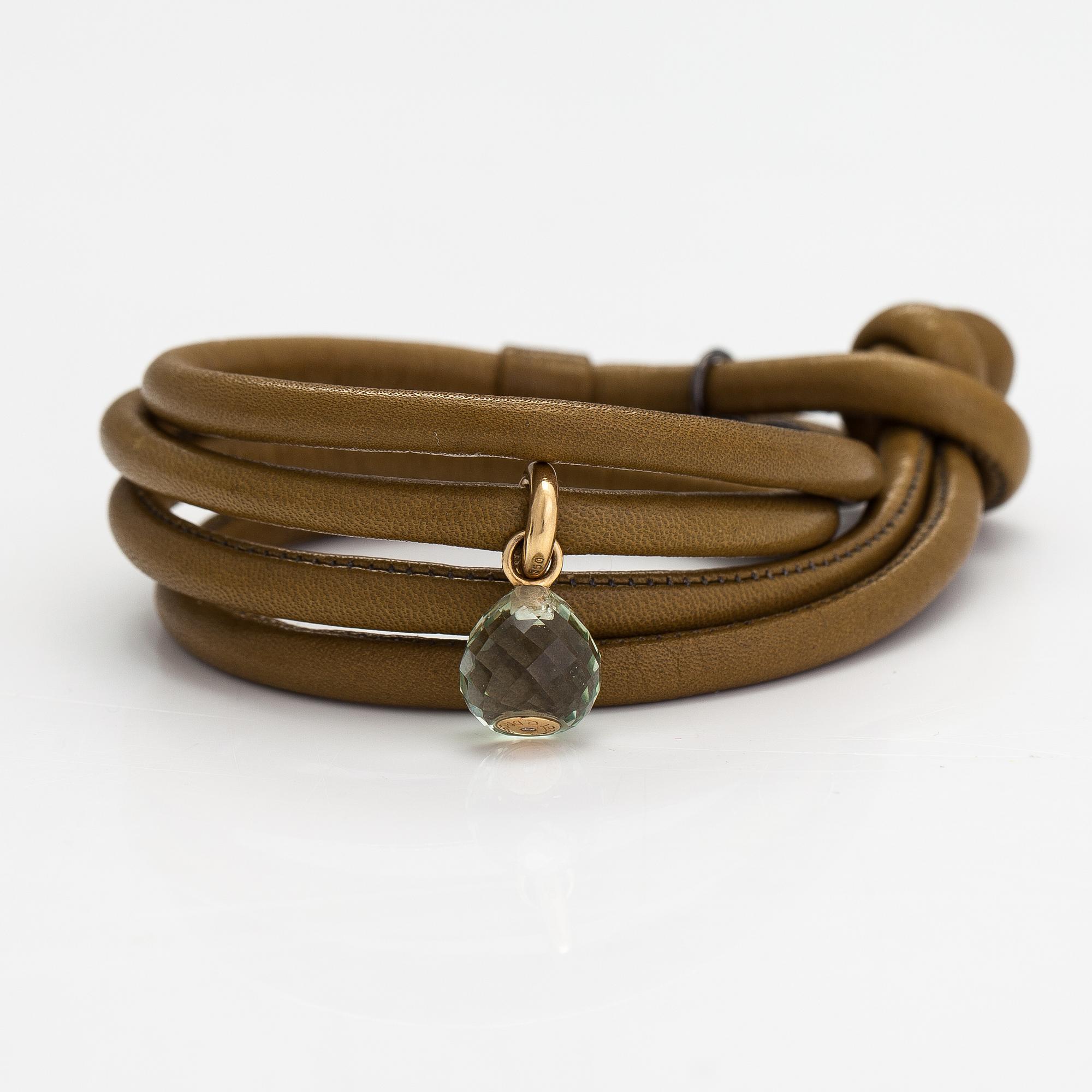 Ole Lynggaard, A 'Sweet drops' bracelet in leather with an 18K gold and green amethyst pendant. Denmark.