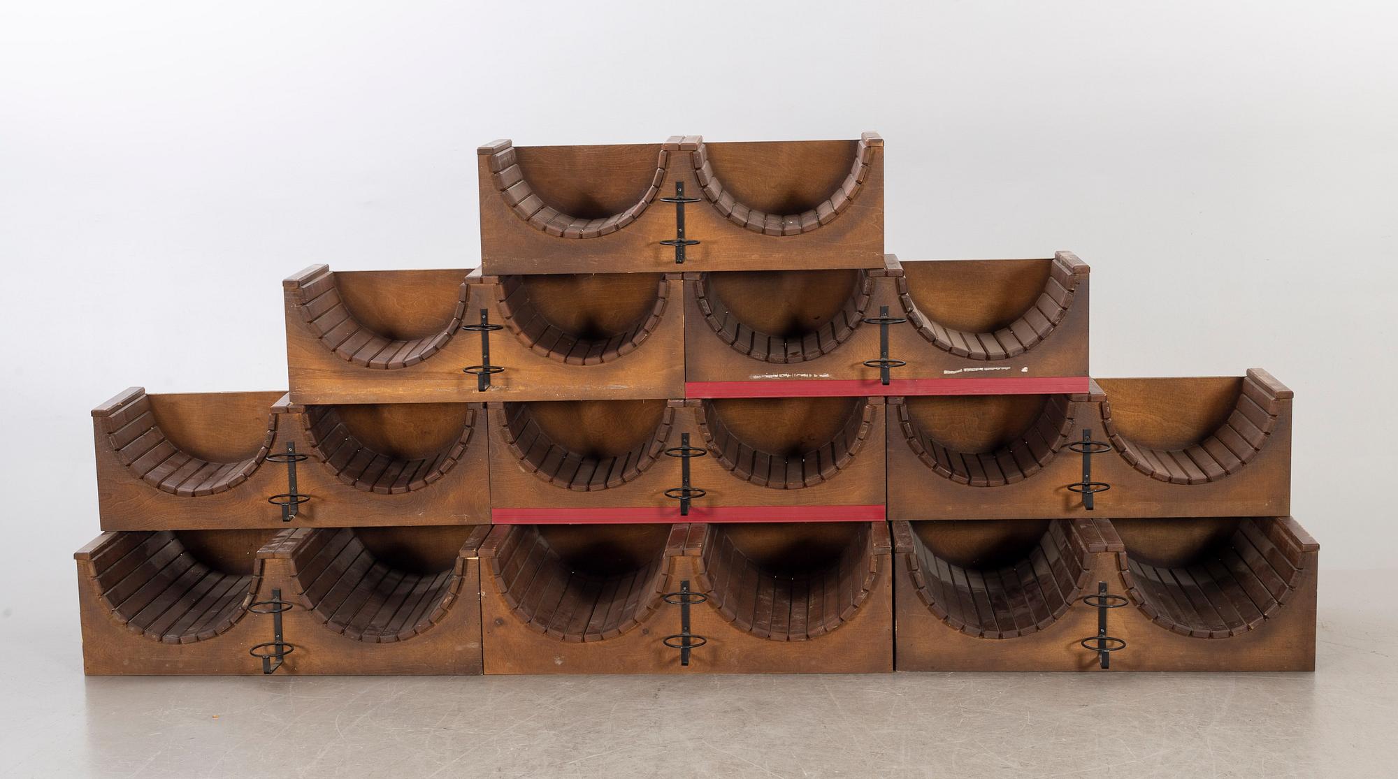 A set of nine loose wood wine racks from the turn of the century 1900/2000.