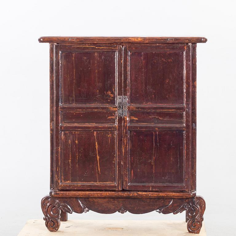A 19TH CENTURY CHINESE CUPBOARD.