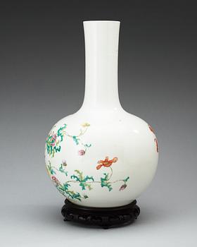 A famille rose vase, late Qing dynasty, with Qianlongs four character mark in red.