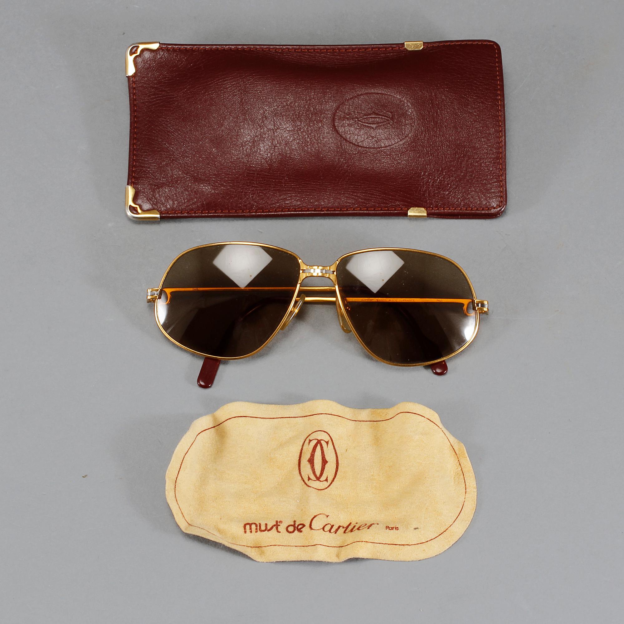 SOLGLASÖGON, Cartier.