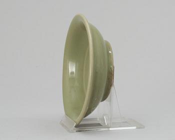 A celadon green Ming plate.
