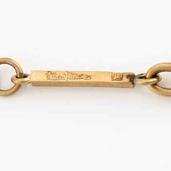 Wiwen Nilsson, an 18K gold necklace with a rock crystal pendant, Lund 1975.