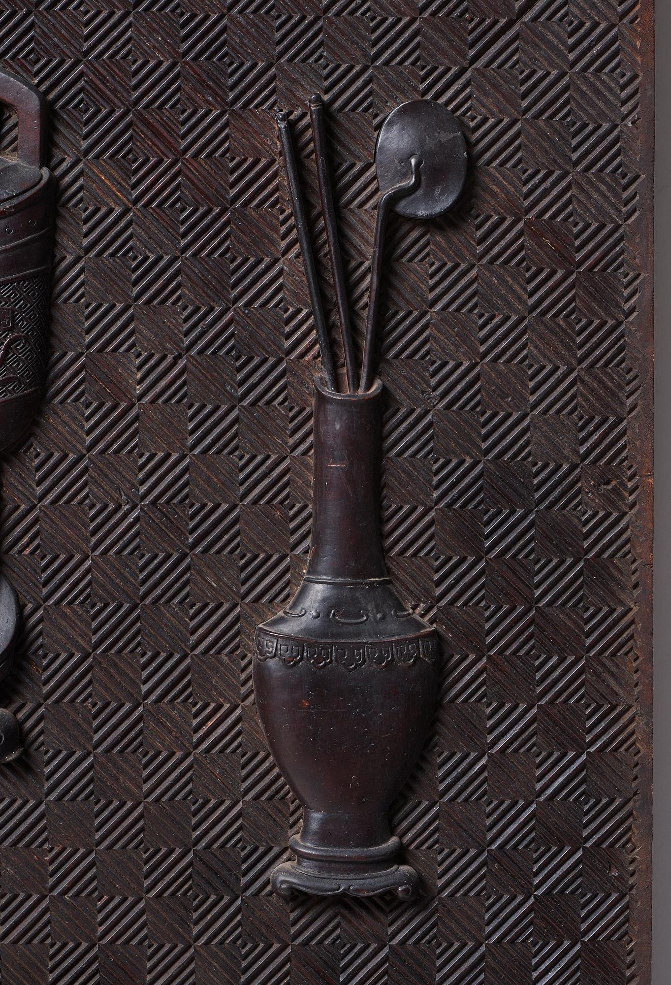 A carved wooden panel, Qing dynasty (1664-1912).