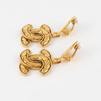 Chanel, a pair of gold tone clip-on earrings, 1990-1992.