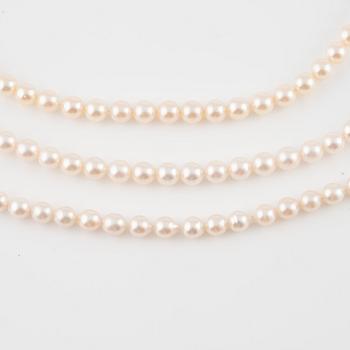 Three strands of cultured pearls, without clasps.