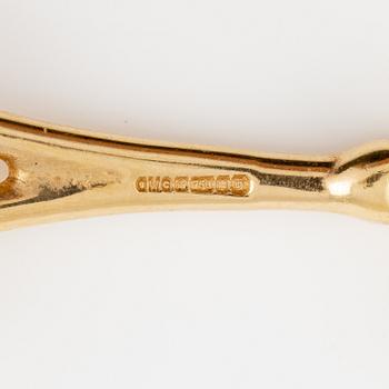 A pair of 18K gold earrings.