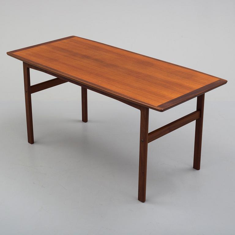 A second half of the 20th century teak vaneered coffee table.
