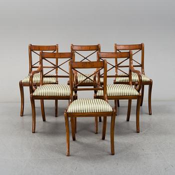 A late 20th century English style dining table and six chairs.