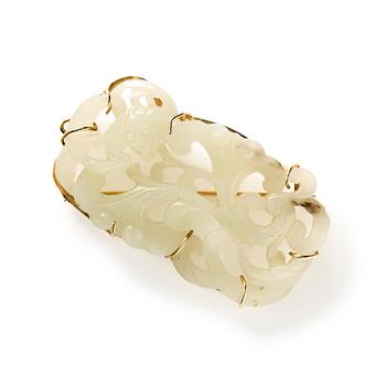 1198. A pale celadon green jade sculpture made in to a brooch, China.