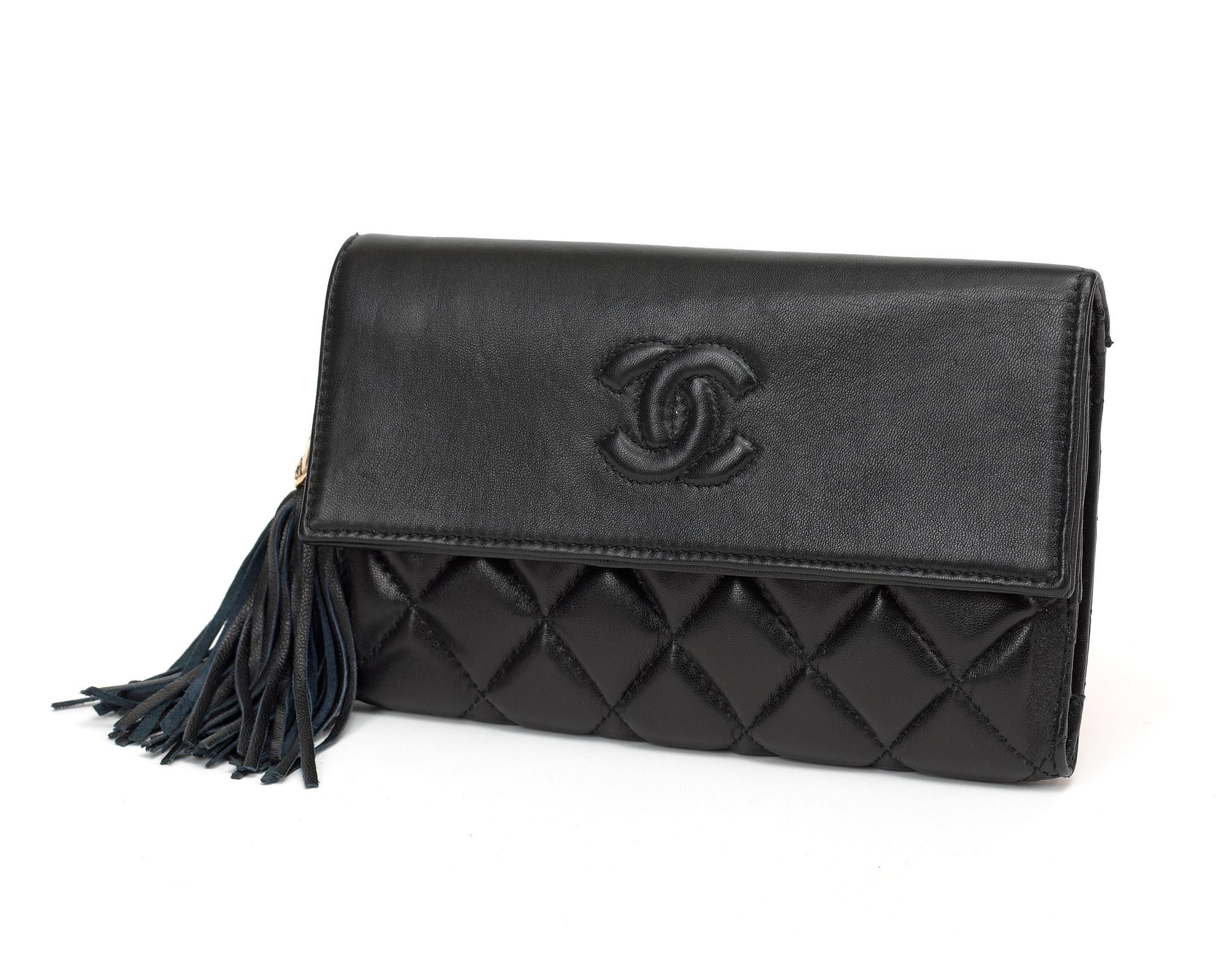 A black quilt leather wallet/evening bag by Chanel.