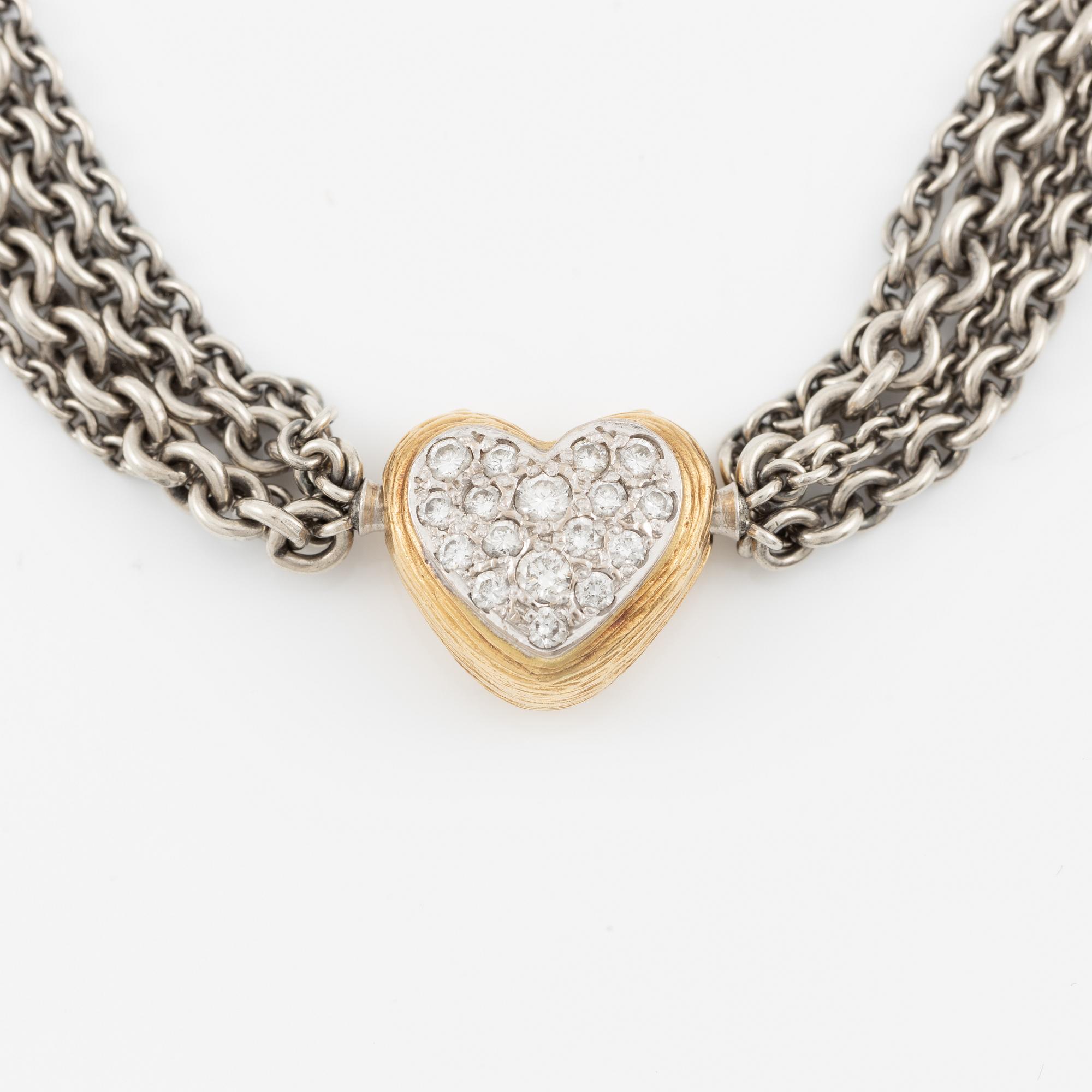 Necklace, Ole Lynggaard, with heart-shaped clasp in 18K gold set with brilliant-cut diamonds, chain in silver with four strands.