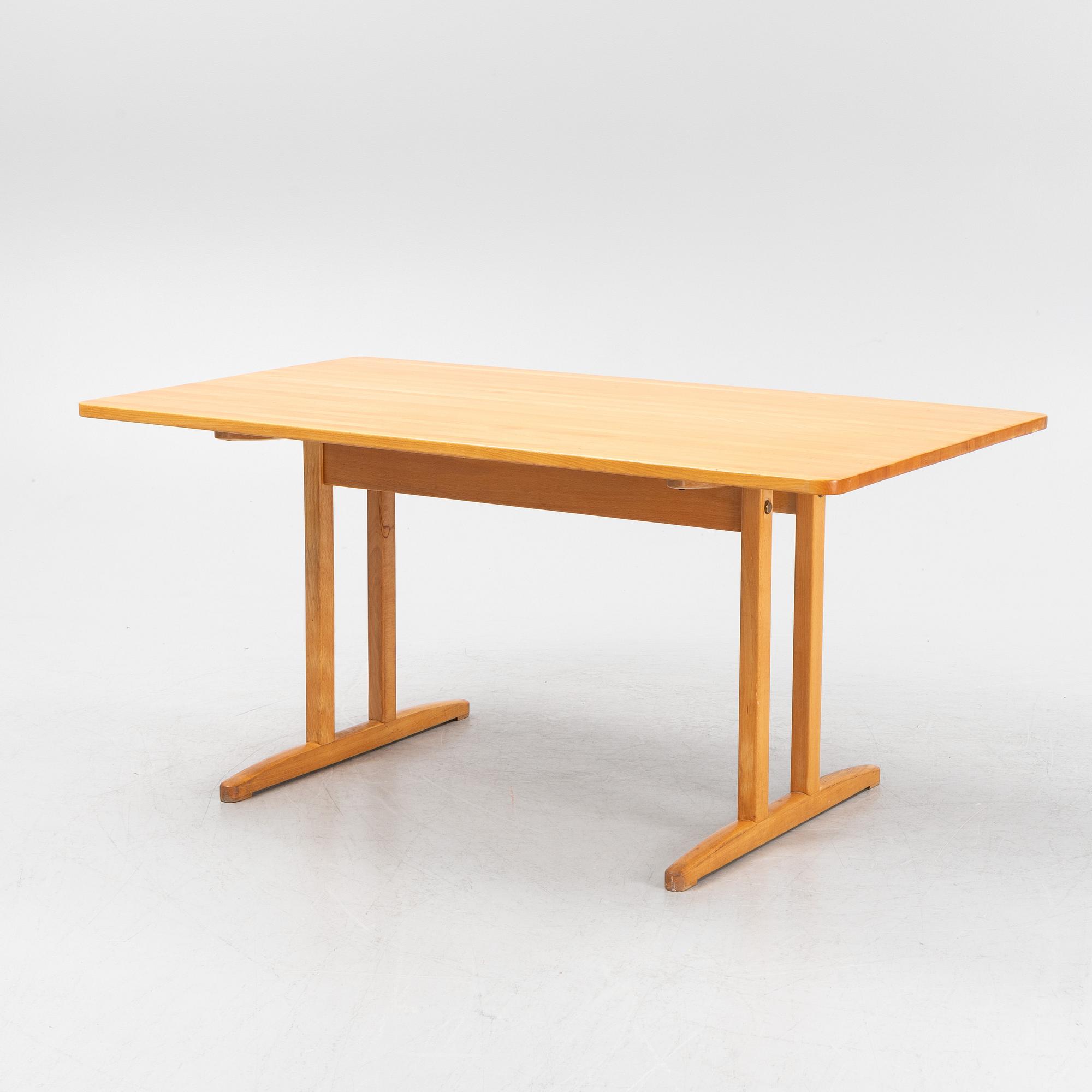 A beech dining table, second half of the 20th Century.