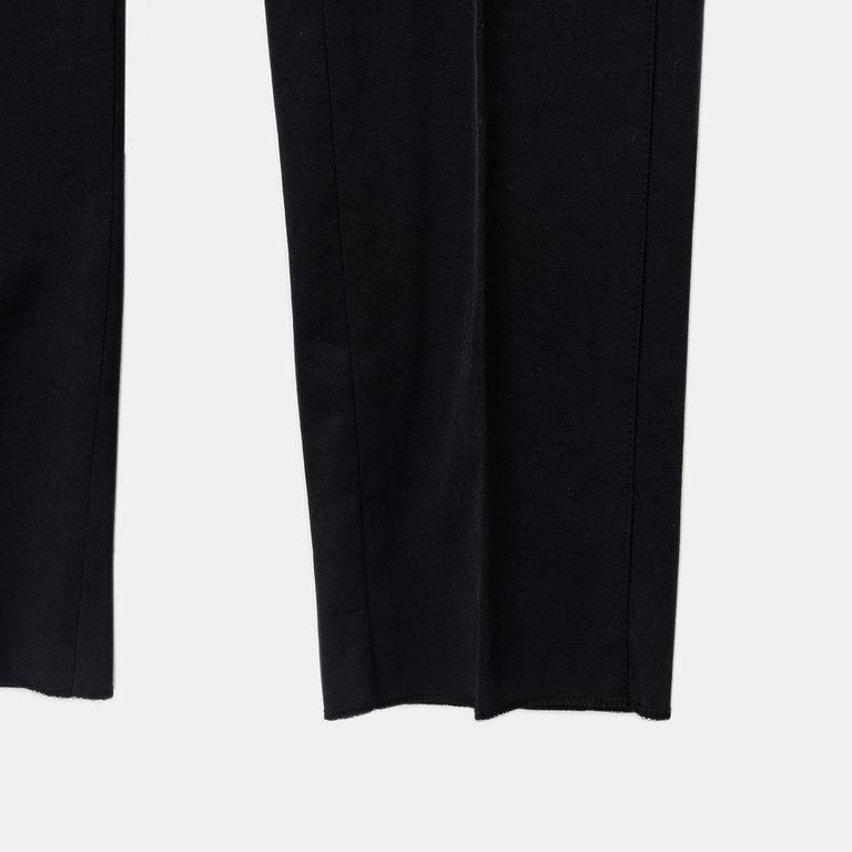 Gucci, a pair of black pants, size 38.