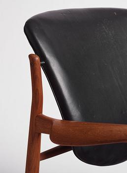 Finn Juhl, a teak and black leather 'model 136' easy chair, France & Daverkosen, Denmark 1950-60s.