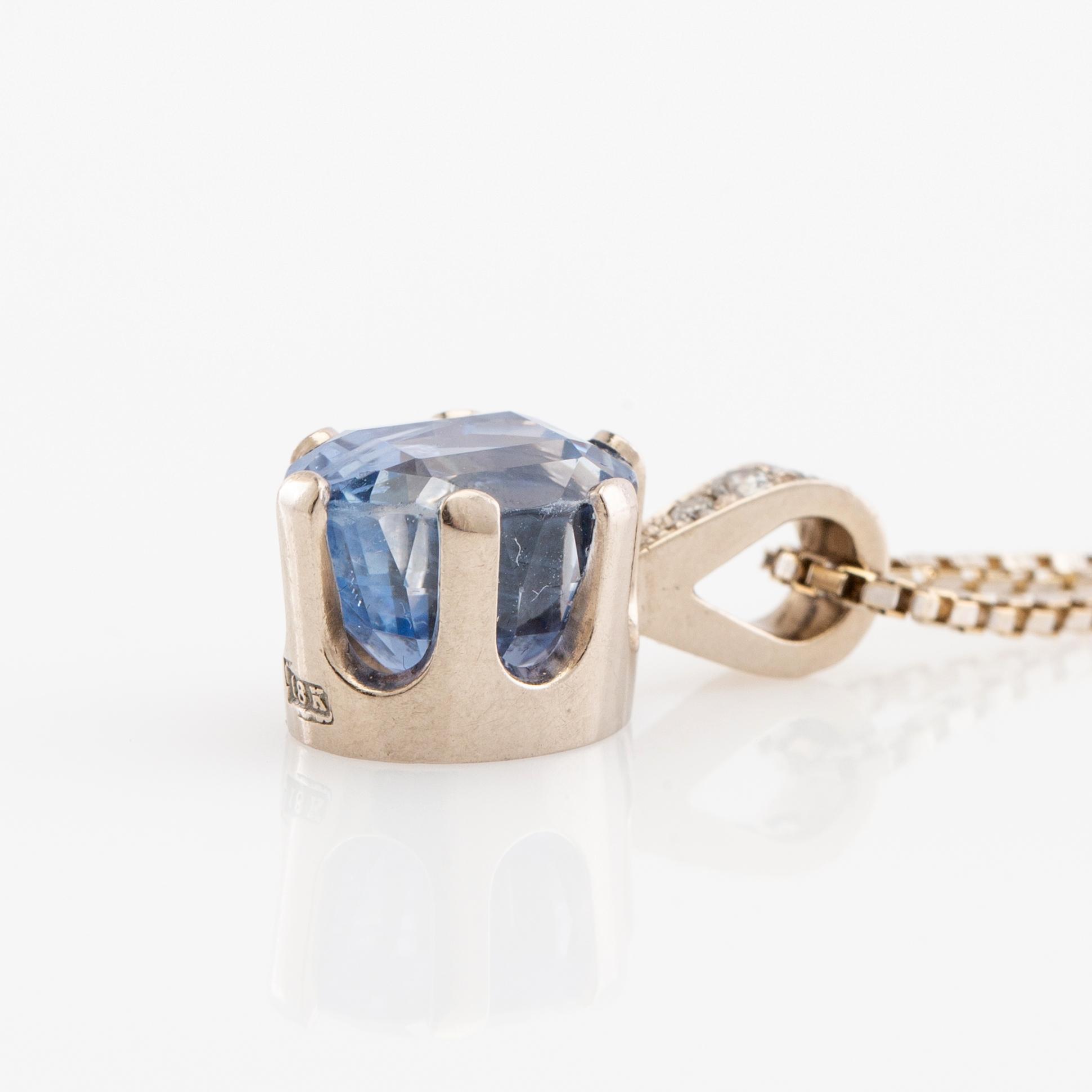 Hängsmycke, 18k vitguld med briljantslipade diamanter och safir.