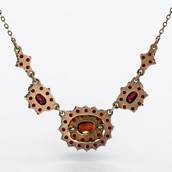 A necklace, brooch and earrings, gilded silver and garnets.