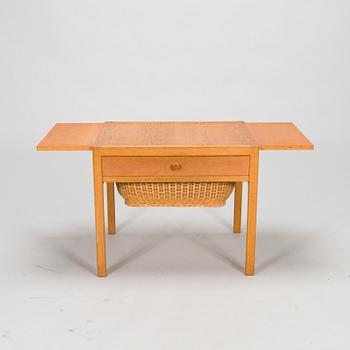 A mid-20th-century sewing table.