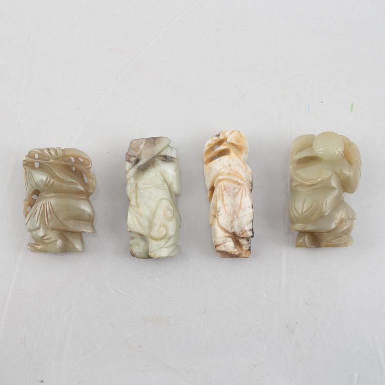 A group of four Chinese stone charms, 20th century.