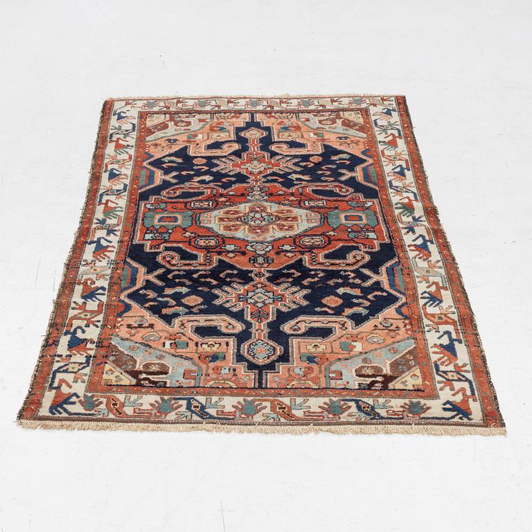 A Heriz rug, c. 192 x 133-139 cm.
