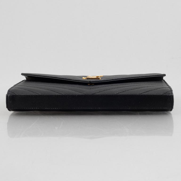 Yves Saint Laurent, a handbag/clutch.