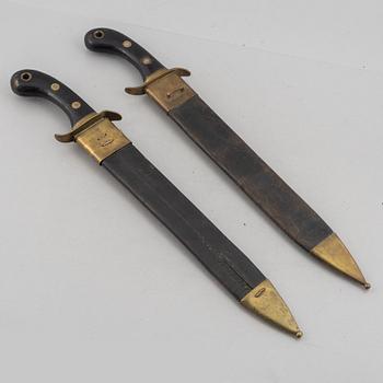 Two Swedish cutlasses 1848 pattern, with scabbards.