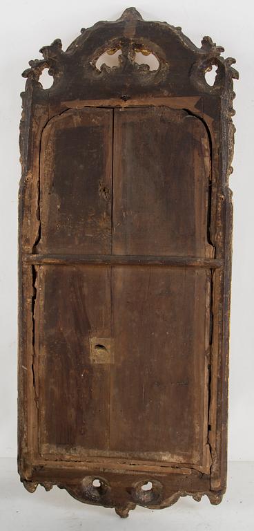 A Rococo mirror, 18th century.