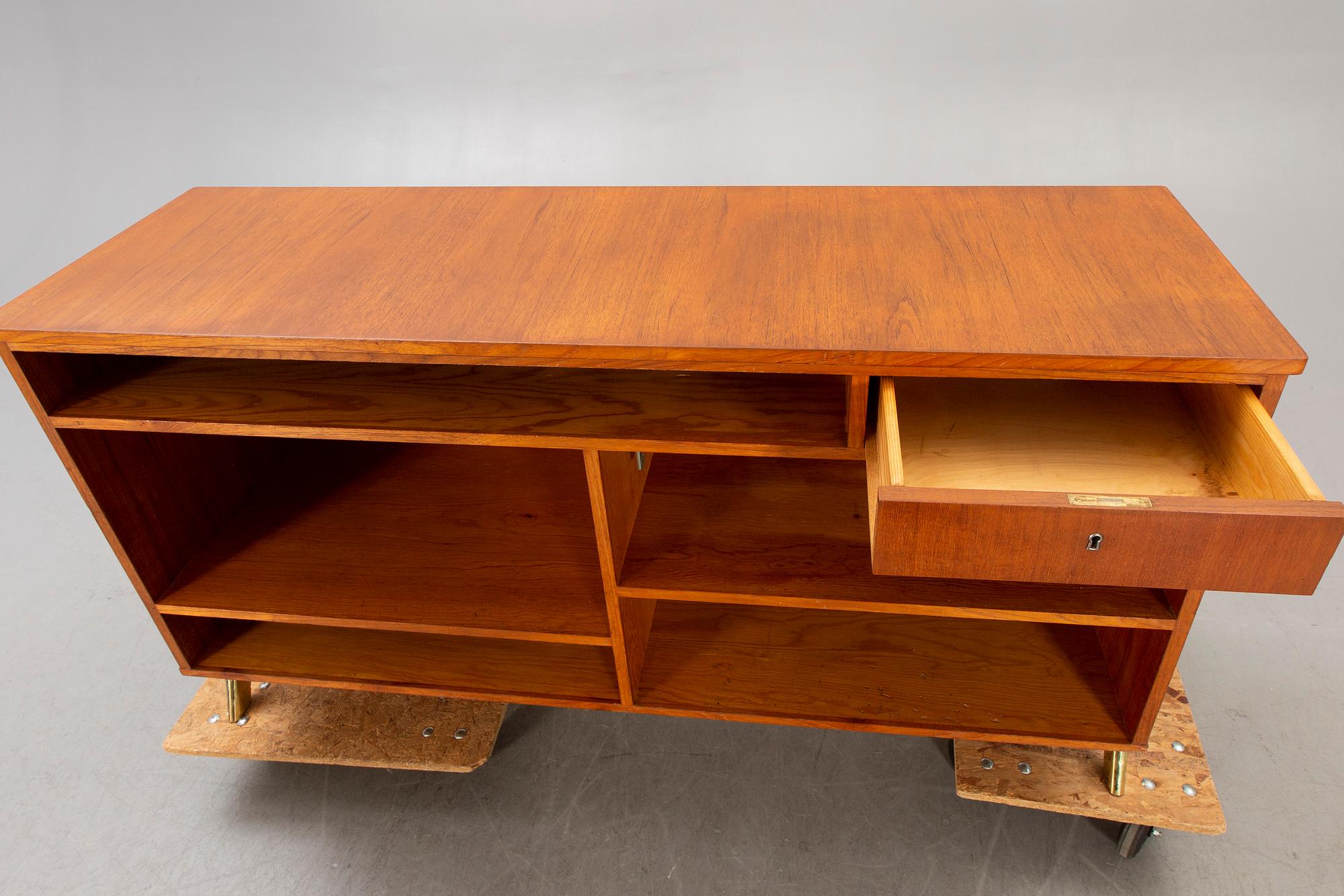 A mid 1900s teak counter.