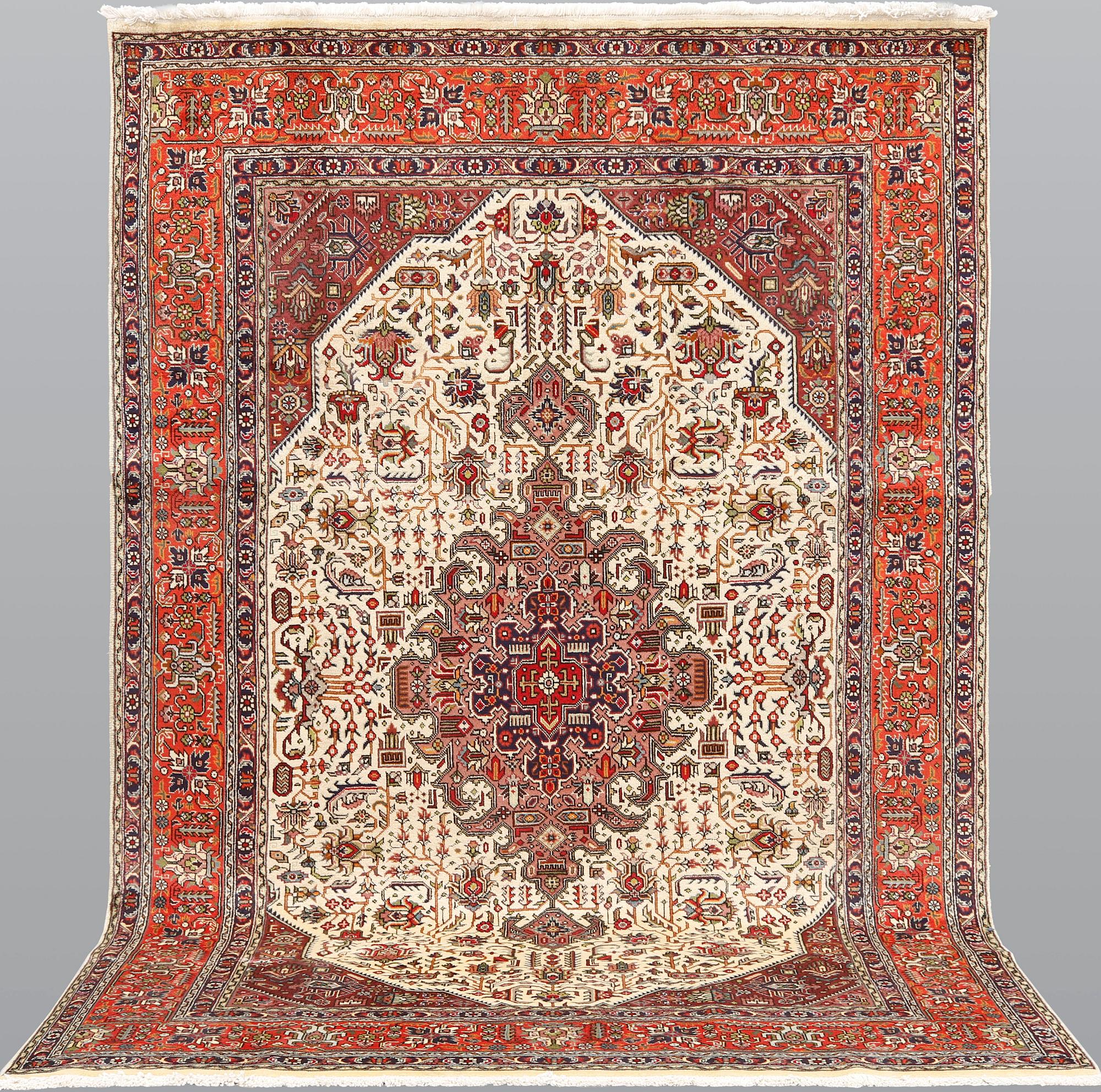 A Tabriz carpet, approximately 298 x 198 cm.