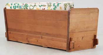 An Axel Einar Hjorth 'Lovö' stained pine sofa, Nordiska Kompaniet, 1930's.