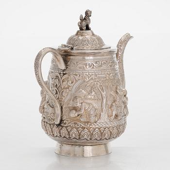 A silver teapot, China.