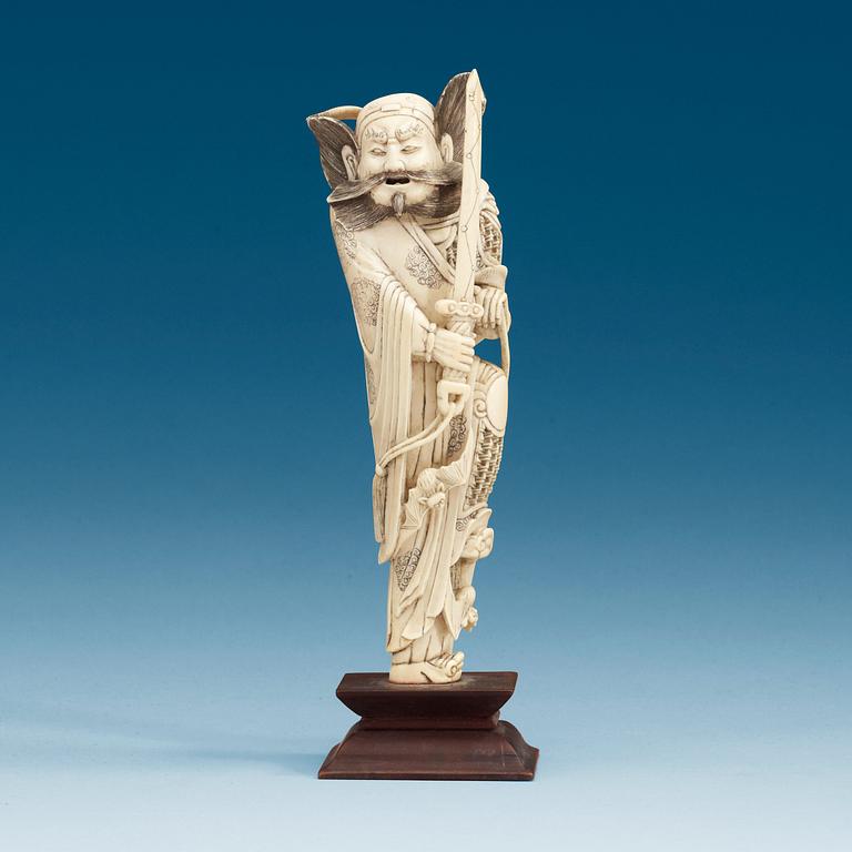 An carved ivory sculpture of a guardsman, China, early 20th Century.