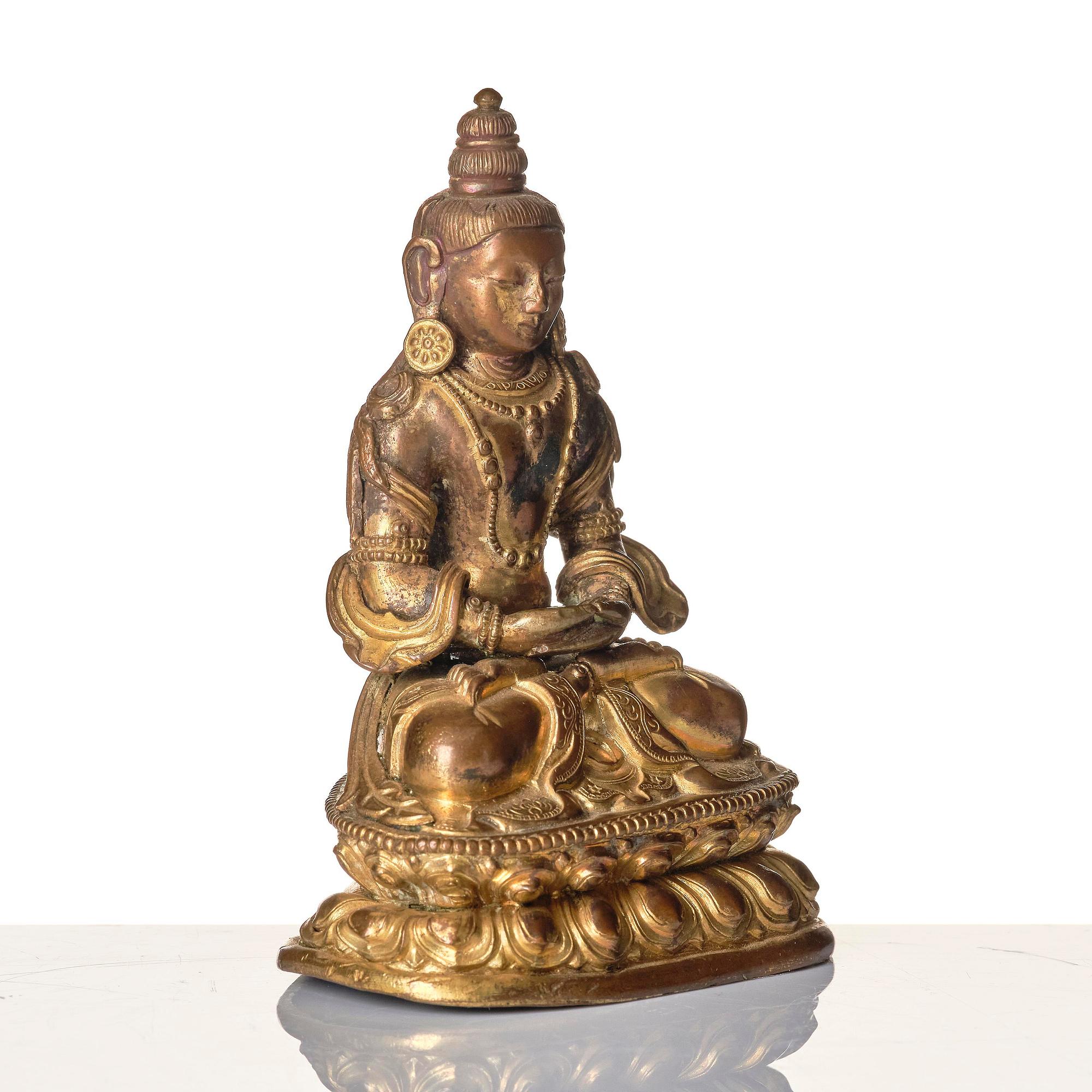 A gilt copper alloy figure of Amitayus, Tibeto-Chinese/Mongolia, 18th century.