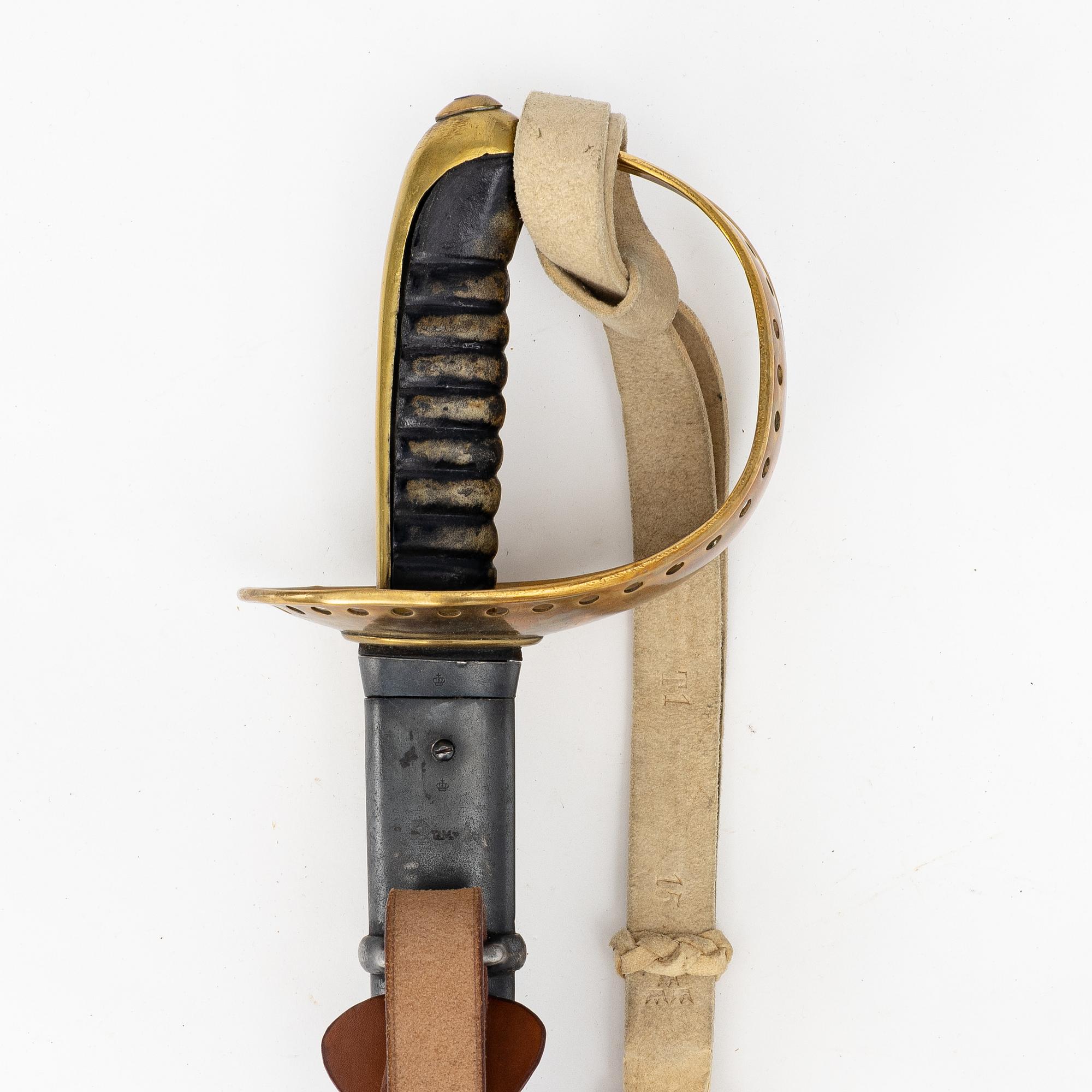 A Swedish 1893 pattern cavalry sabre, with scabbard.