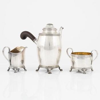 A Swedish Silver Coffee Pot, Creamer and Sugar Bowl, mark of CG Hallberg, Stockholm 1917-18.