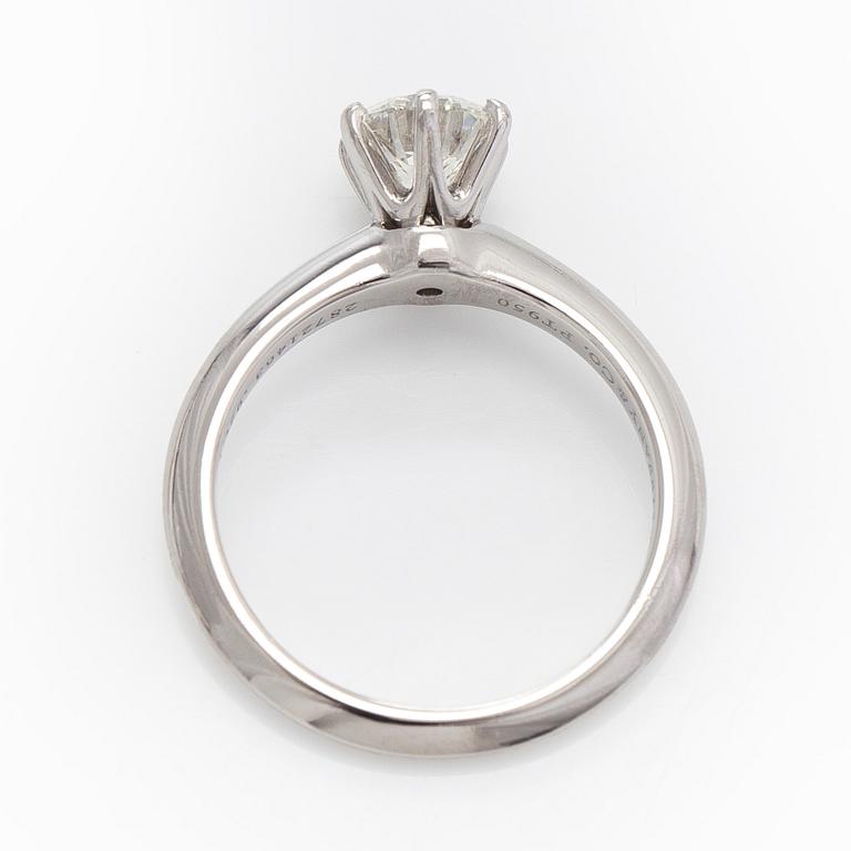 Tiffany & Co, a platinu solitaire ring with a brilliant-cut diamond.