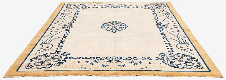 An antique Chinese carpet, 404 x 304 cm.