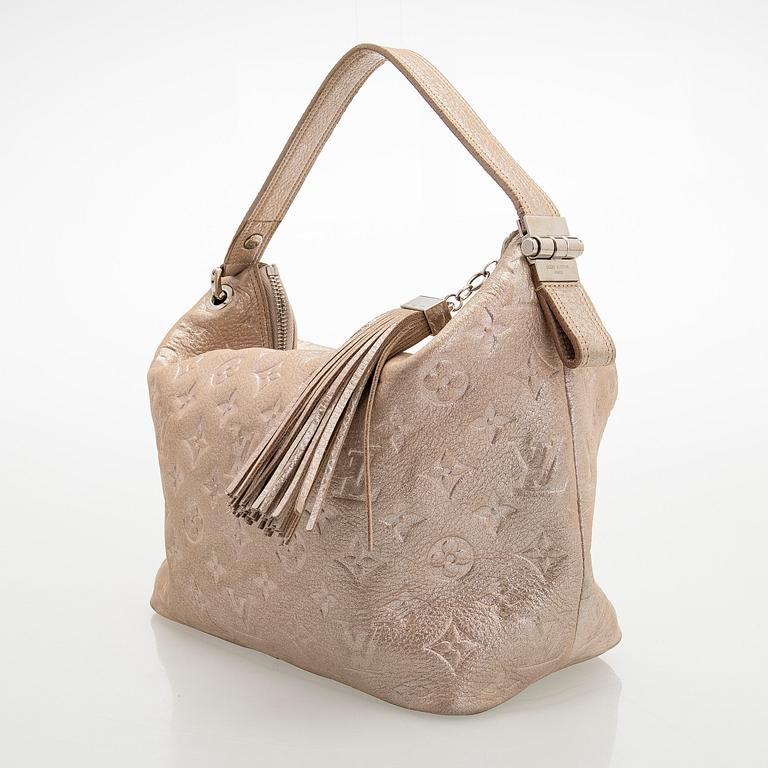 Louis Vuitton, a shimmer 'Halo' bag.