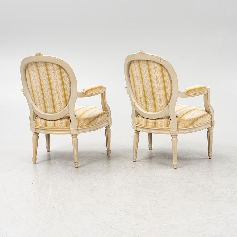 A pair of Gustavian style armchairs signed J.G.A, mid 20th century.