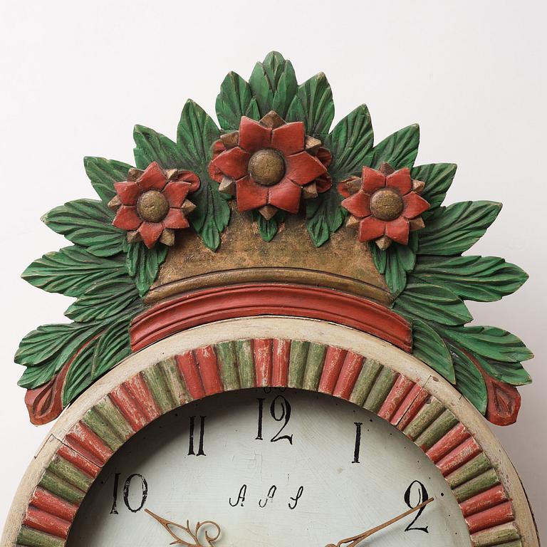 a painted wall pendulum clock from Ångermanland in the first half of the 19th century.