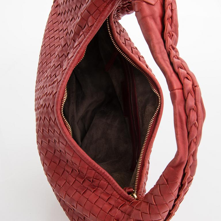 Bottega Veneta, a red leather 'Veneta' Bag.