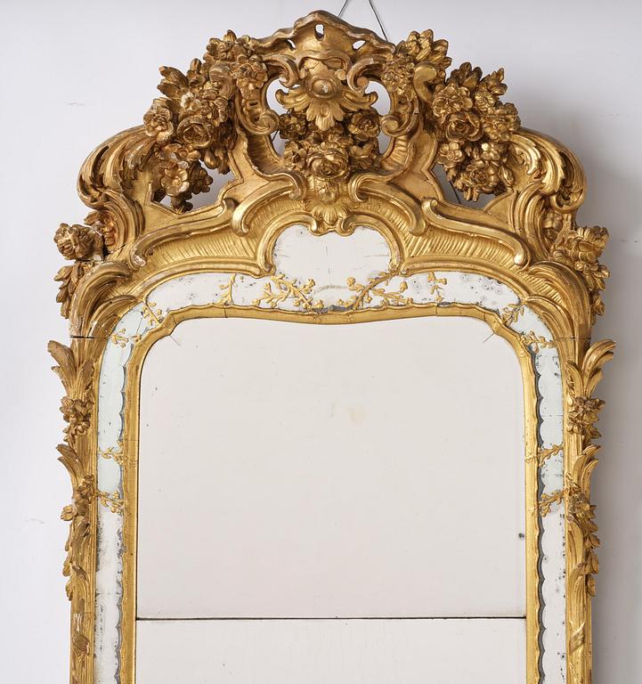 A giltwood rococo mirror, Stockholm, later part 18th century.