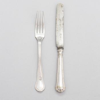 A set of silver-plated cutlery, forks with engraved coat of arms, Russian blades with the Imperial warrant mark.