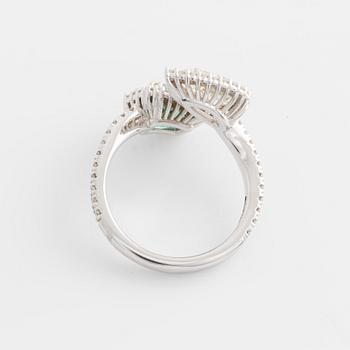 Ring with emerald-cut emerald and pear-shaped diamond, accompanying GIA diamond report.