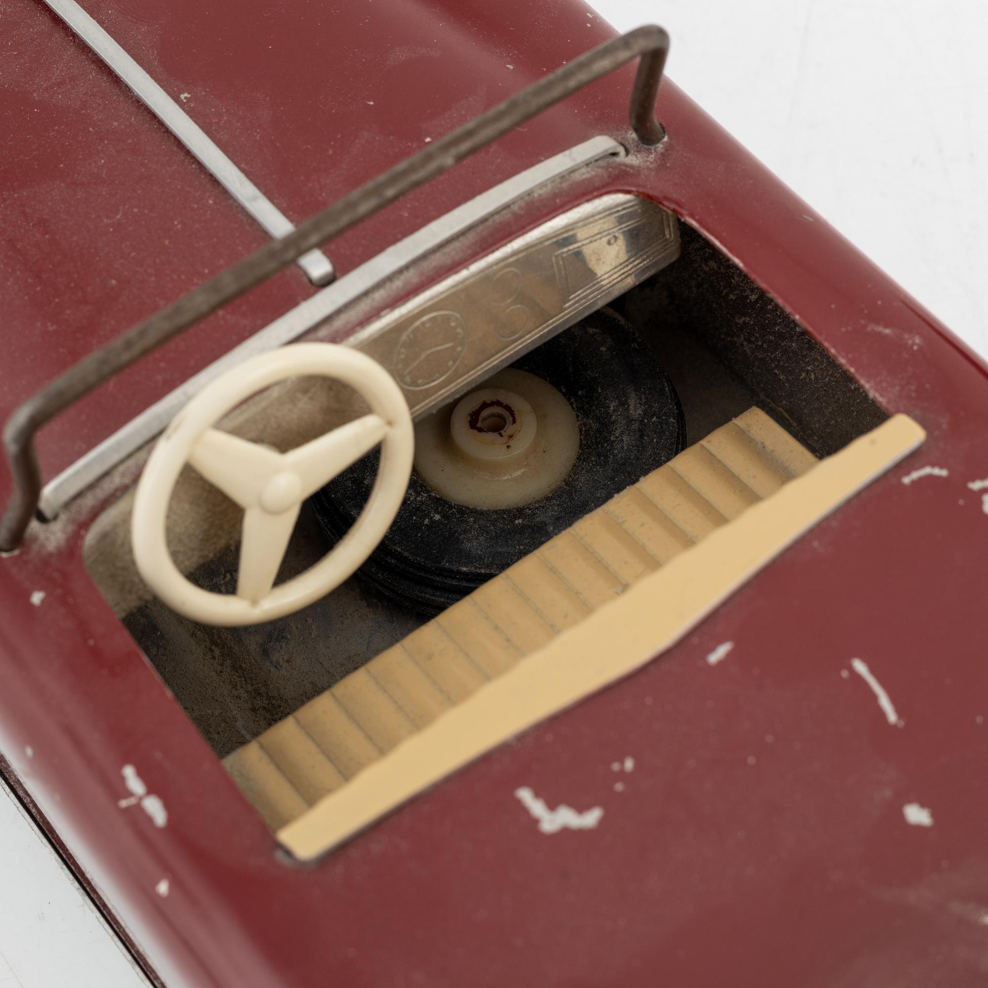 Four toy cars, including Nomura Toys, Japan, 20th century.