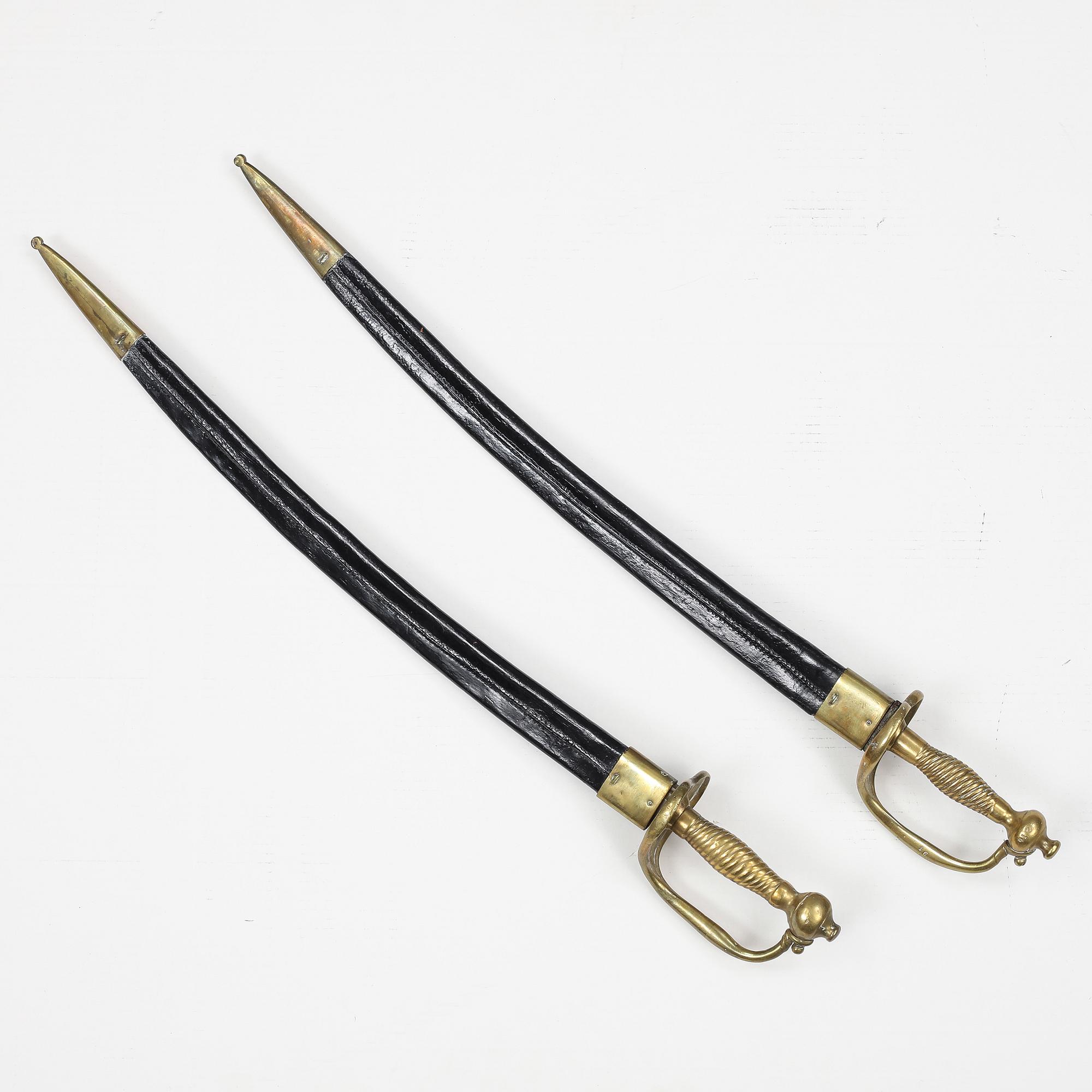 Two Swedish cutlasses 1748-1856 pattern with scabbards.